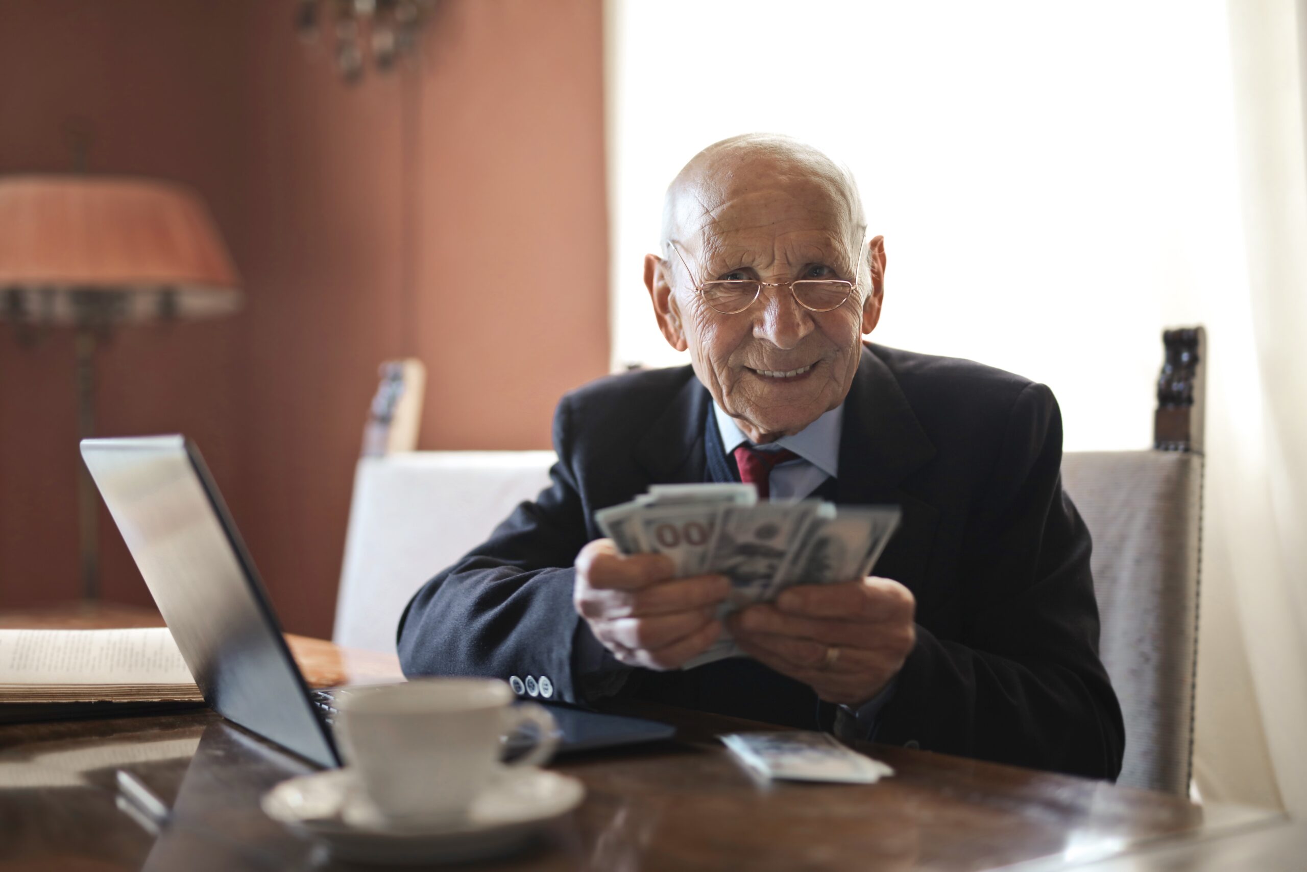 Senior Citizen fanning cash